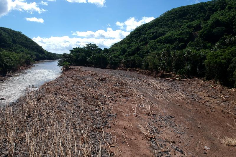 Drone view of a river valley with flood debris and sediment deposits